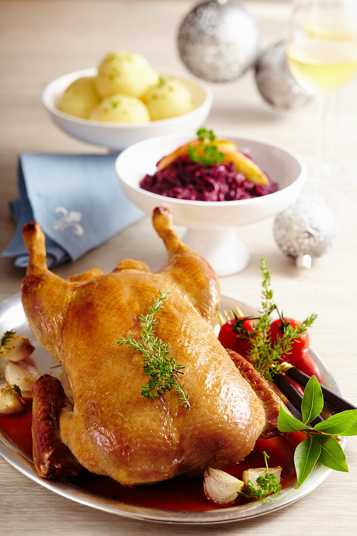 Roasted duck with herbs, red cabbage and potato dumplings