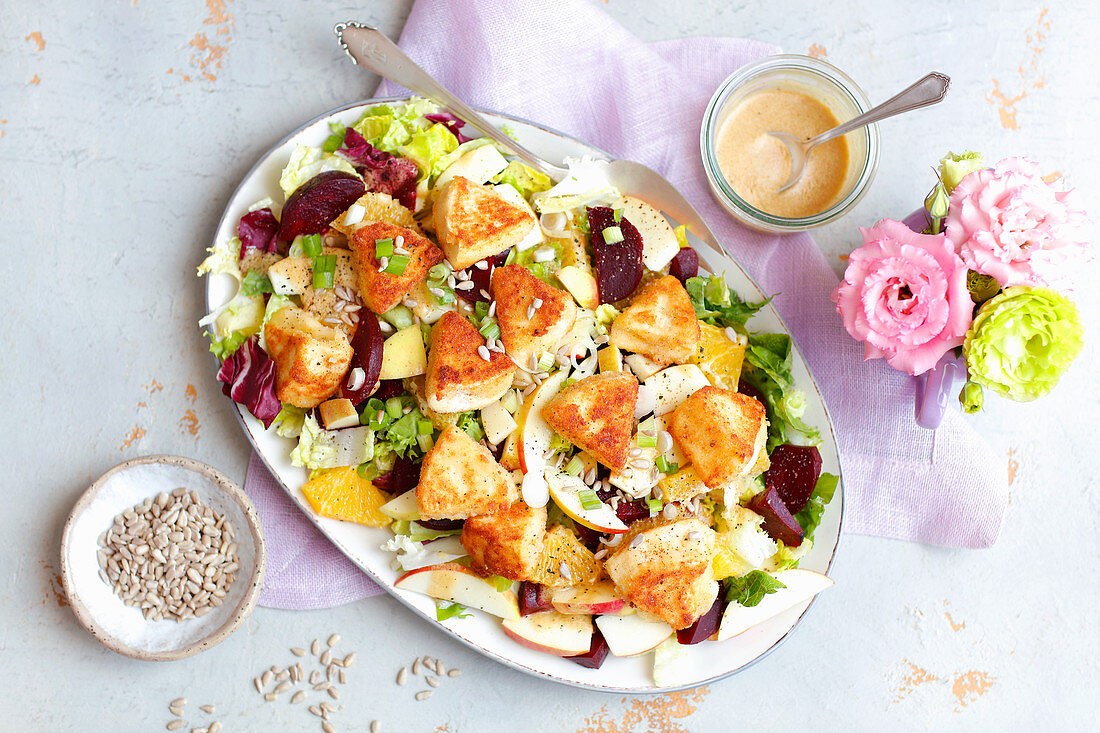Salad with beets, apple and fried camembert
