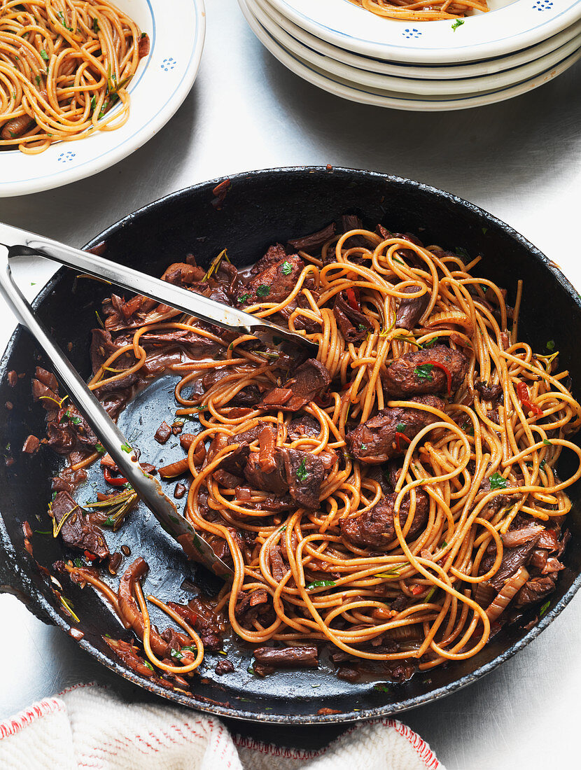 Spaghetti with sausage and porcini mushrooms