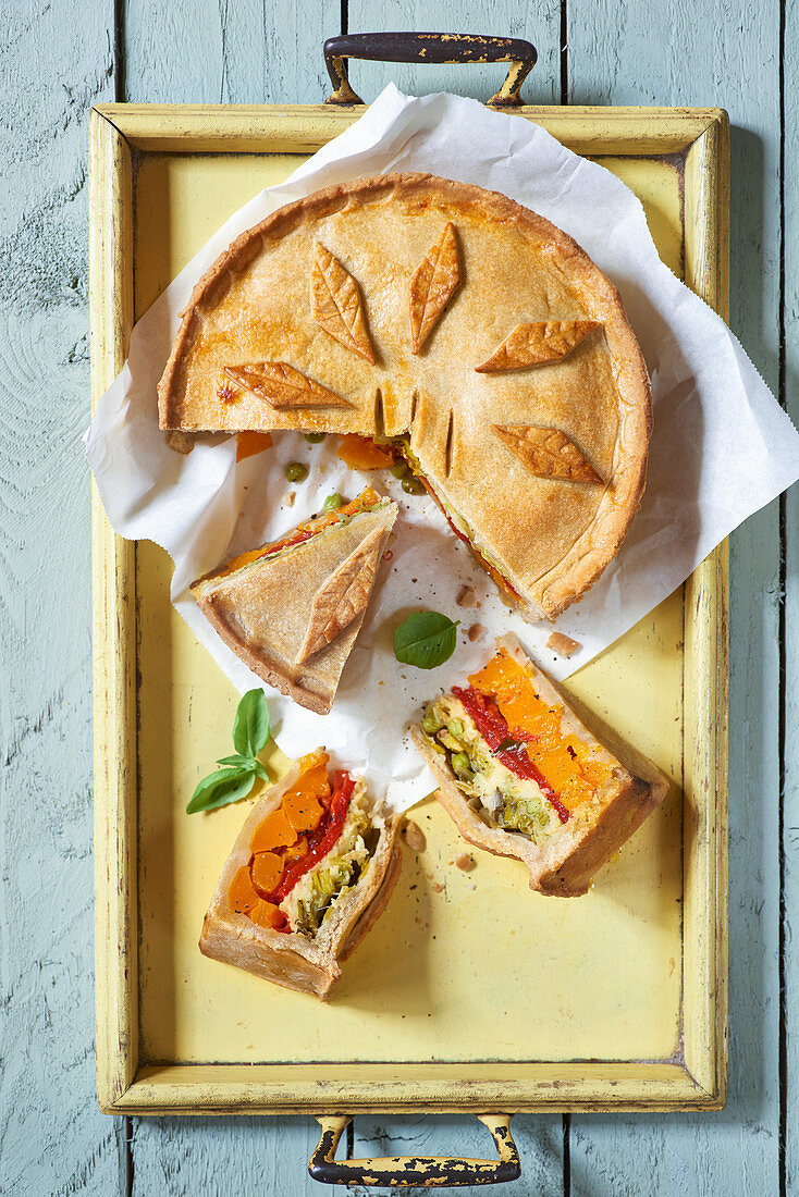 Vegetable pie with pastry leaves, sliced