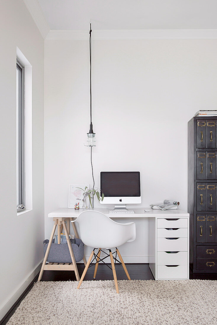 Desk on a pedestal and drawer cabinet