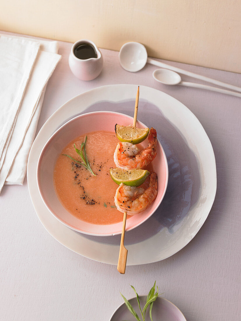 Melon and tomato gazpacho with a shrimp skewer