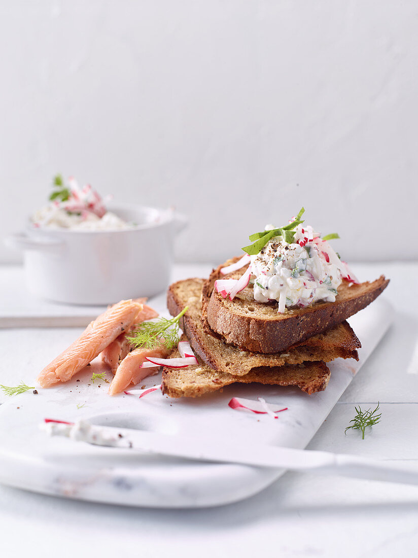 Rye bruschetta with cream cheese, radish cream and char