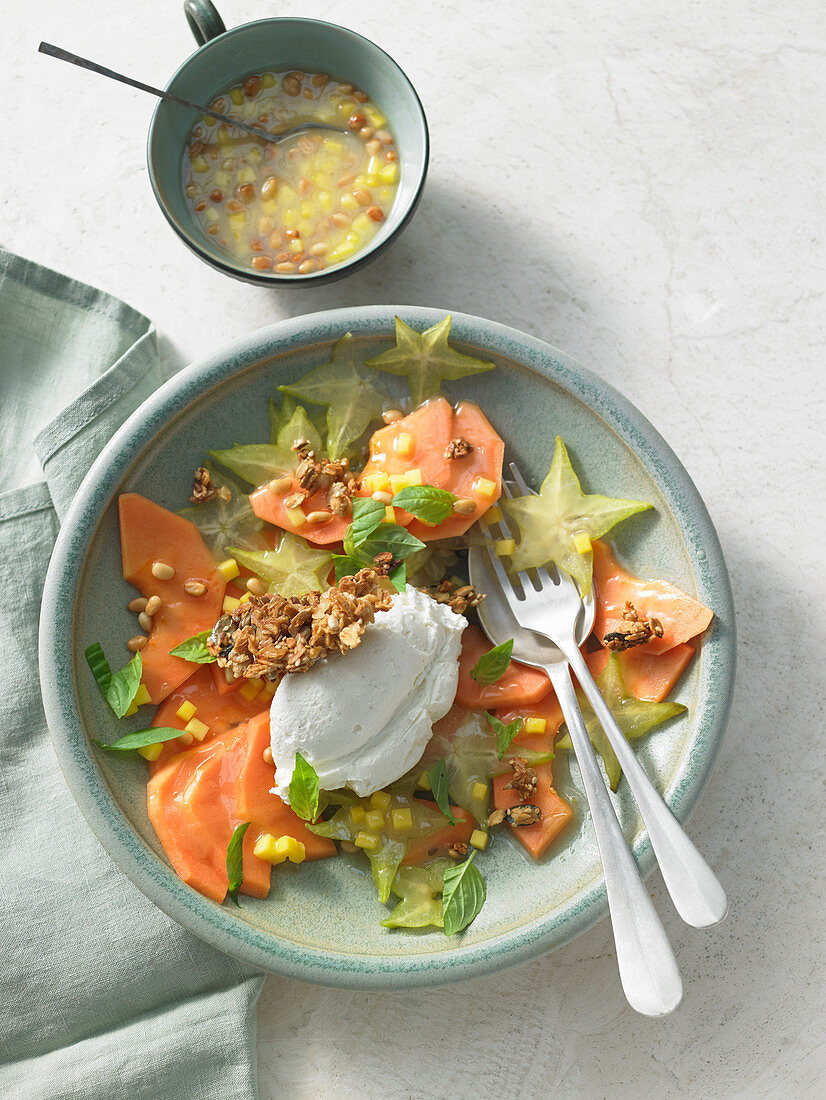 Papaya and star fruit carpaccio with a mango dressing and vanilla labneh