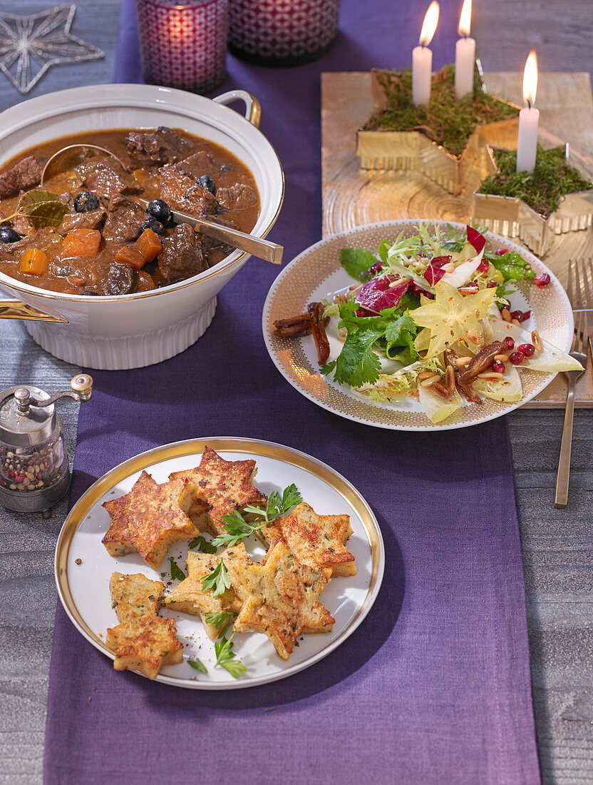 A Christmas buffet with wild goulash, blueberry and chicory salad and bread dumpling stars