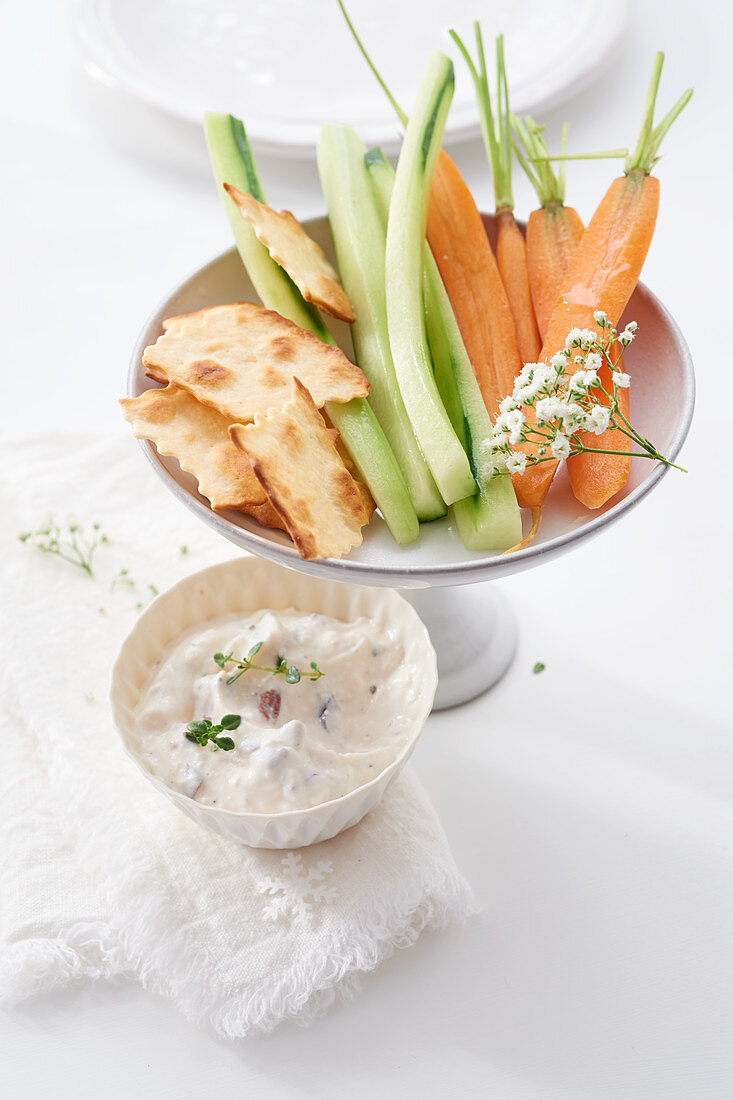 Sheep's cheese and olive dip with raw vegetables (cucumber, celery, carrots)