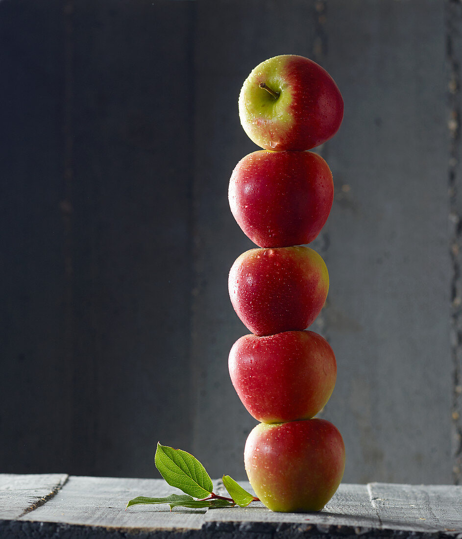 Red apples stacked in a tower