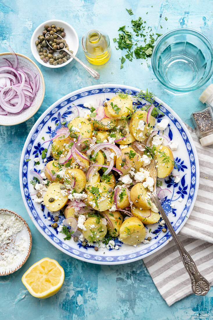 Greek potato salad with red onions and feta