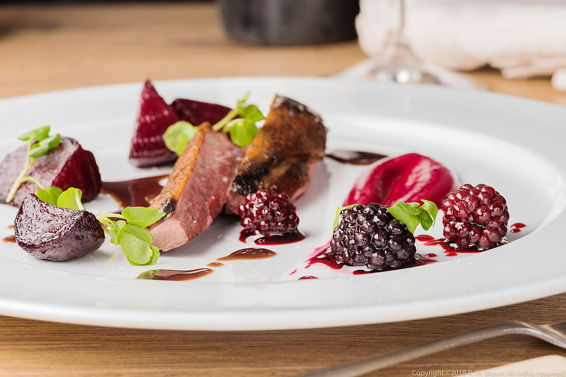 Wild duck with blackberries and beetroot