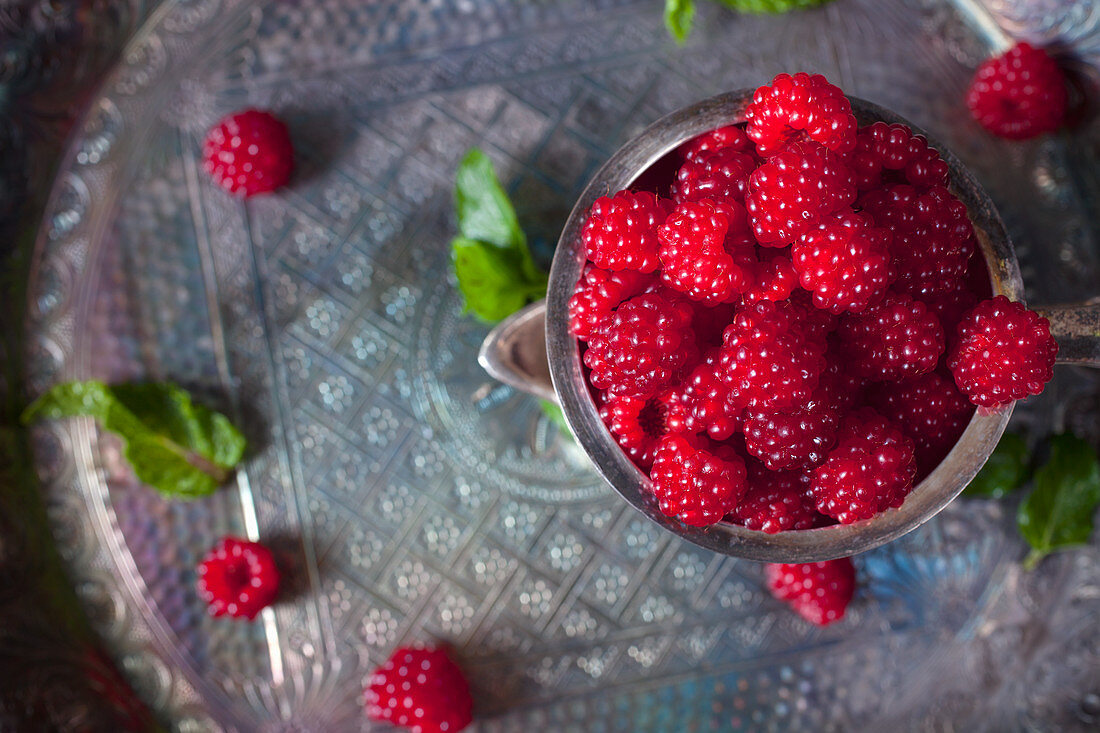 Wild Raspberries Piled in a Silver Cup