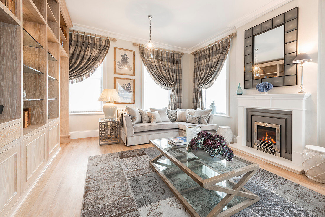 Fireplace in elegant living room in shades of grey