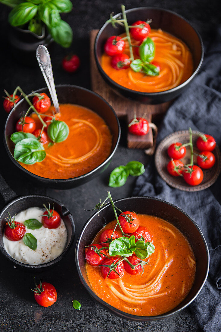 Creamy tomato soup with noodles and baked cherry tomatoes
