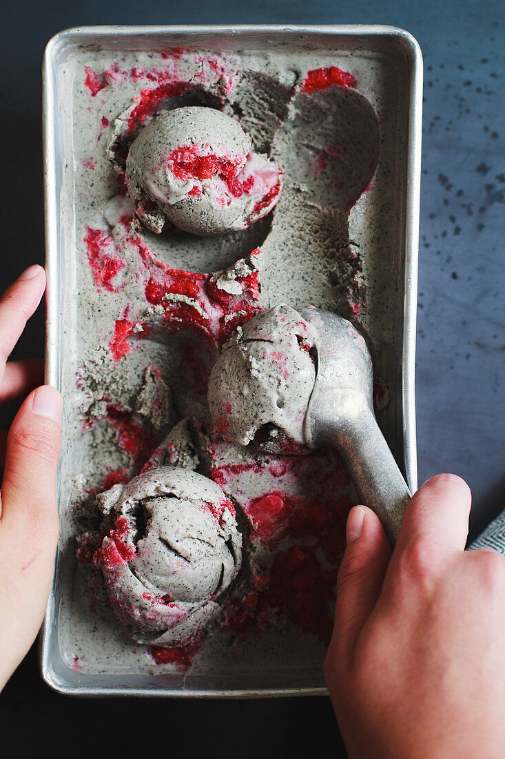 Black sesame seed ice cream with strawberry swirl