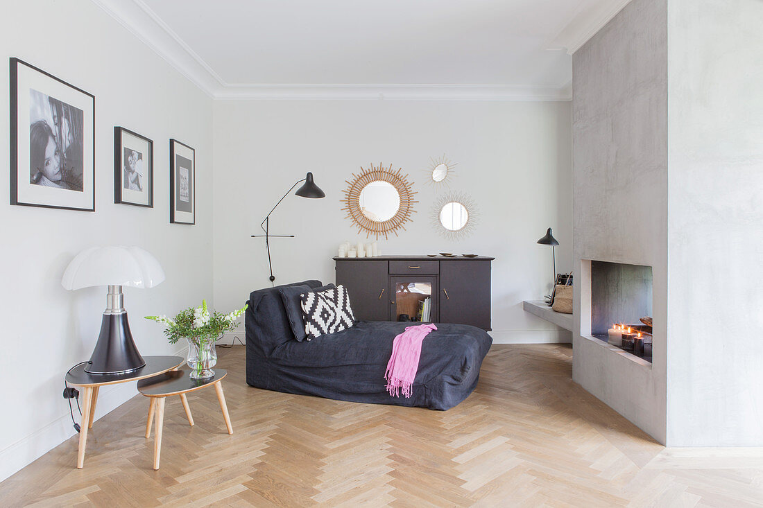 Coffee table and chaise longue in front of fireplace