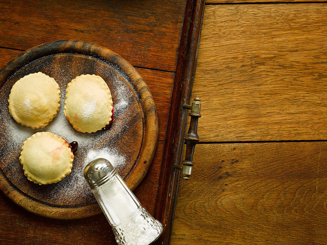 Stuffed fruit tarts with powdered sugar