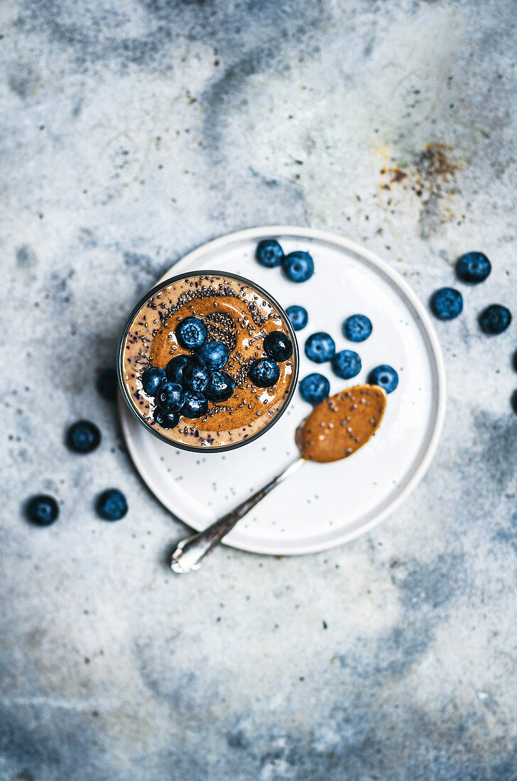 Chocolate almond butter smoothie with chia and blueberries.
