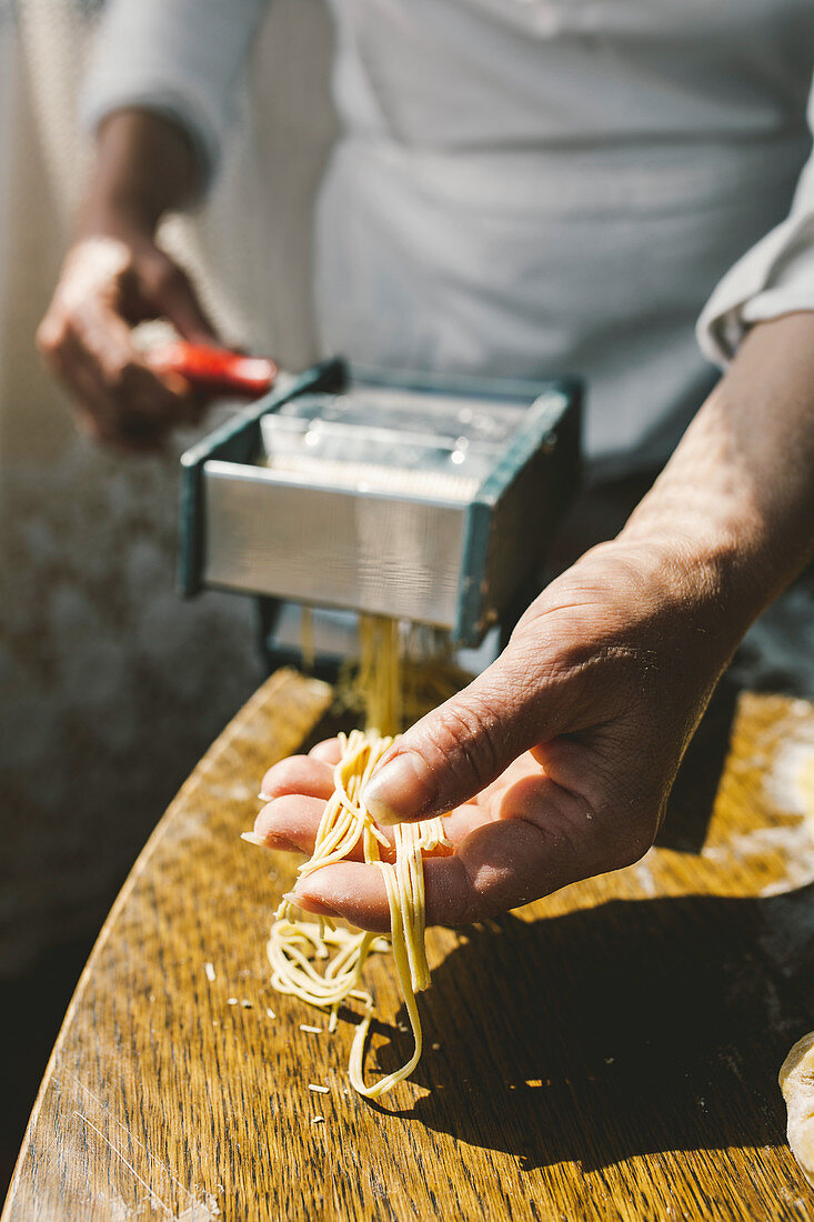 A woman making homemade pastain the traditional way