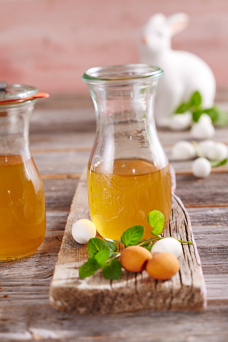 Homemade carrot liqueur in mason jars for Easter