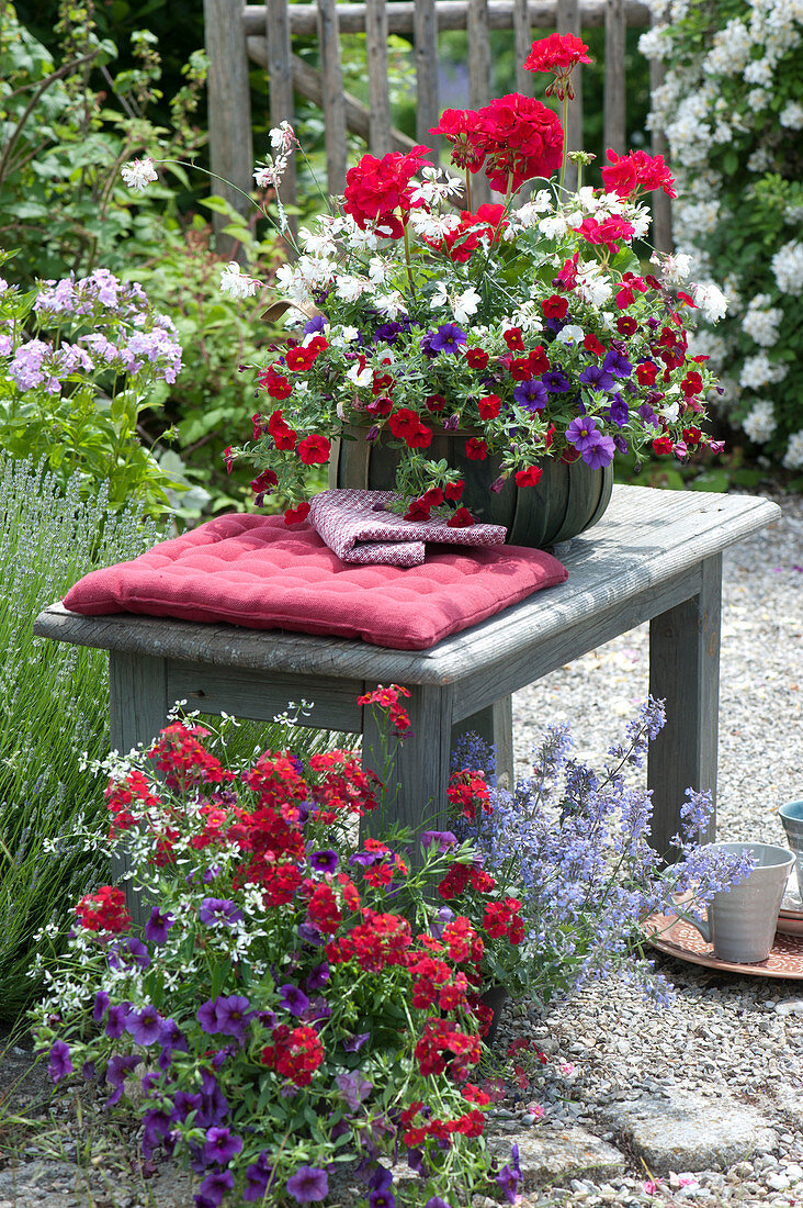 Red - white - purple planted baskets with balcony flowers