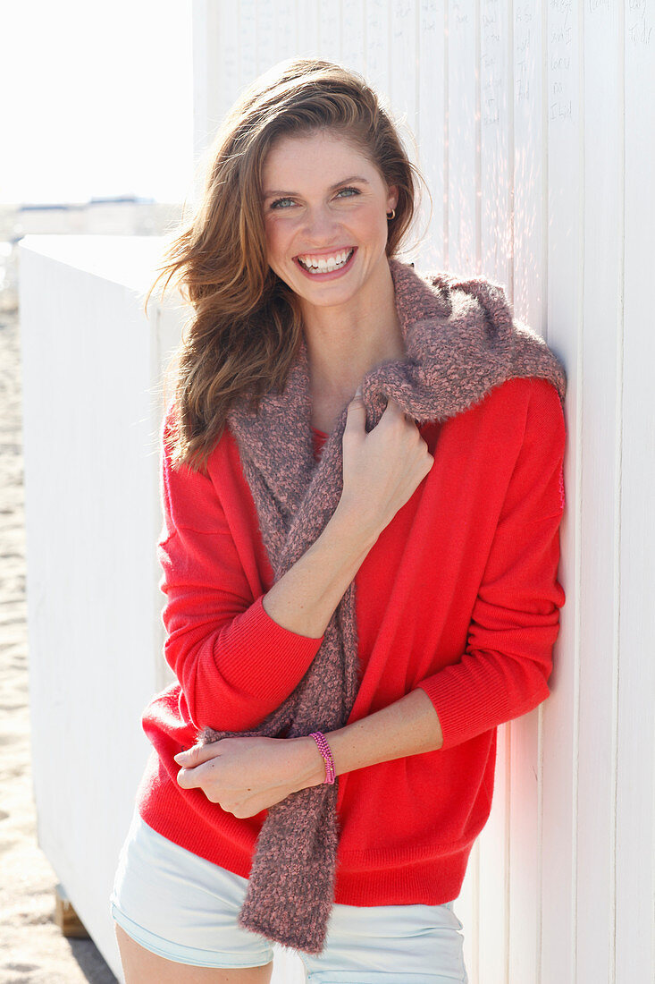 A young woman wearing a red jumper