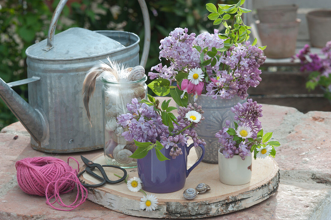 Small Bouquets With Lilac On Wooden Disc