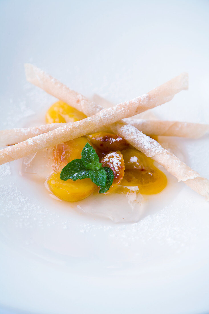 Glazed mirabelles with crispy almond sticks and wine jelly