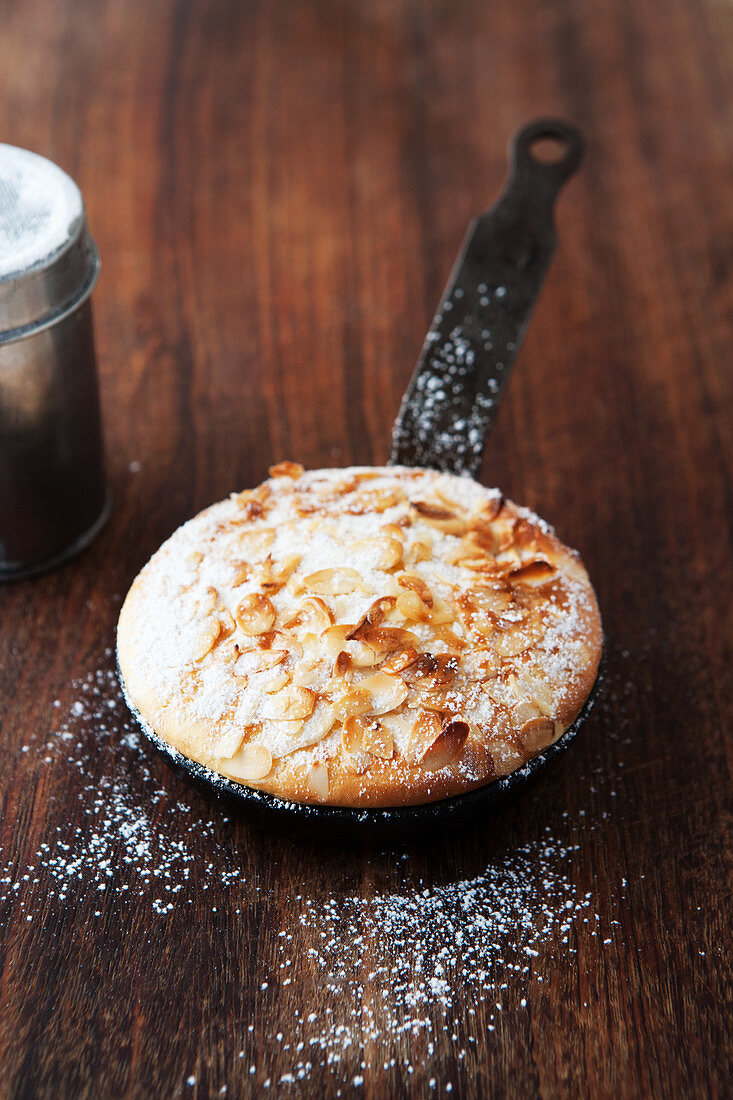 Airy, oven-baked almond cake served in a pan