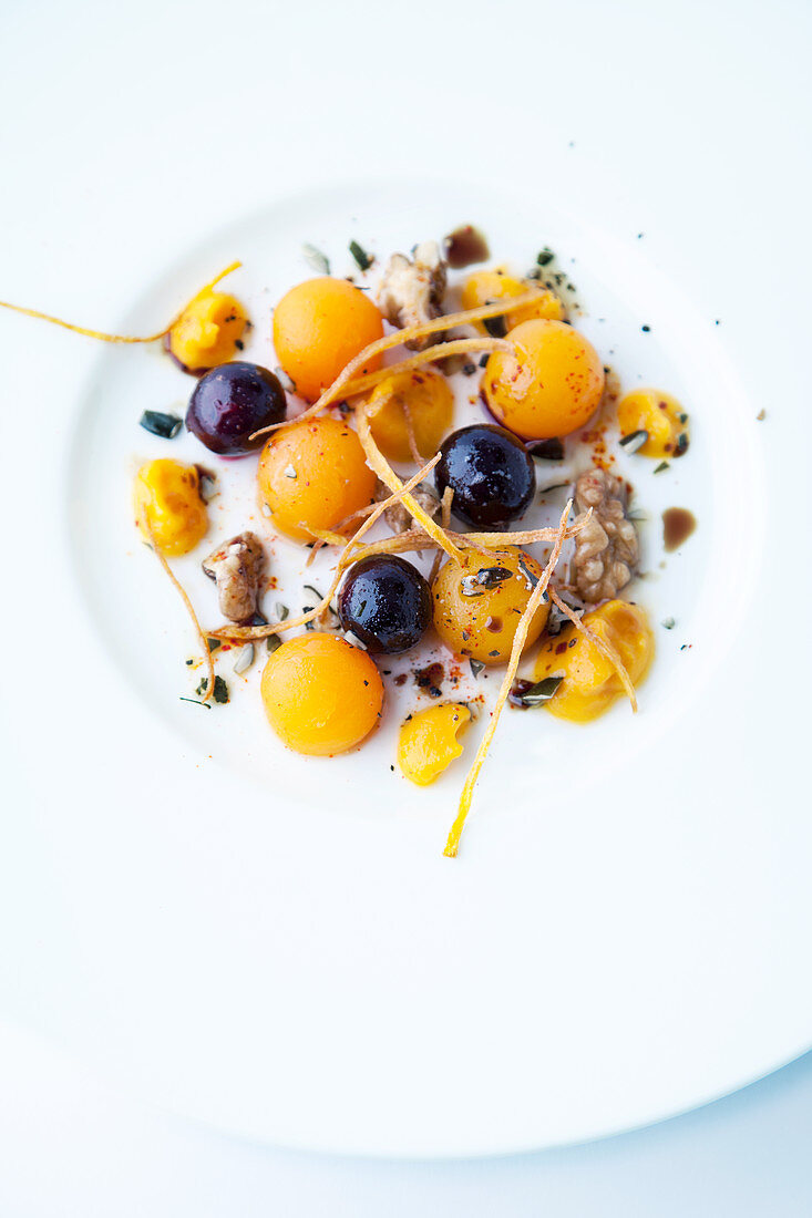 Autumnal pumpkin balls with grapes and walnuts