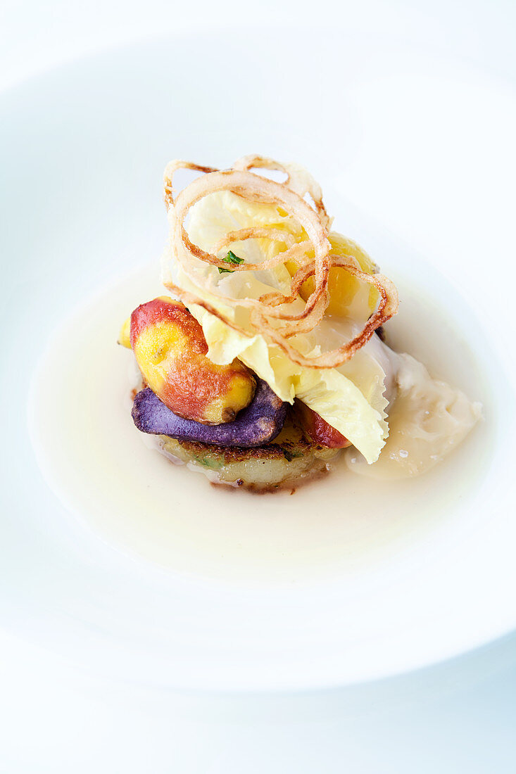 Potato fritters and mini potatoes with onion rings