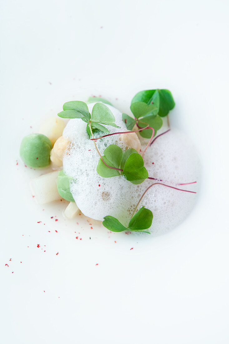 White asparagus with avocado cream, wood sorrel and pink pepper