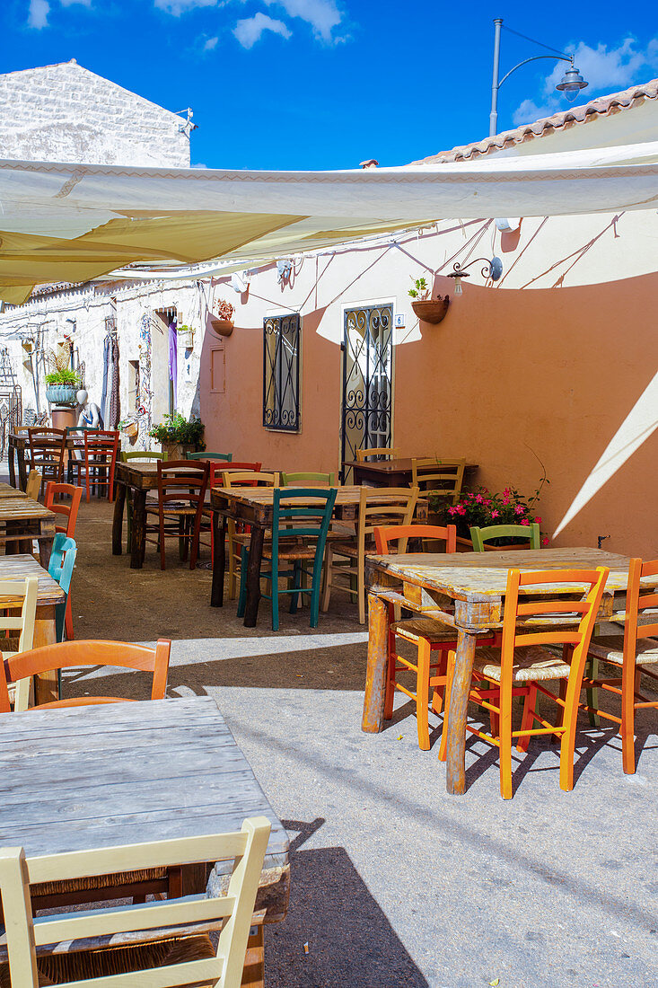 Tables and chairs in front of a restaurant in San Pantaleo, Sardinia