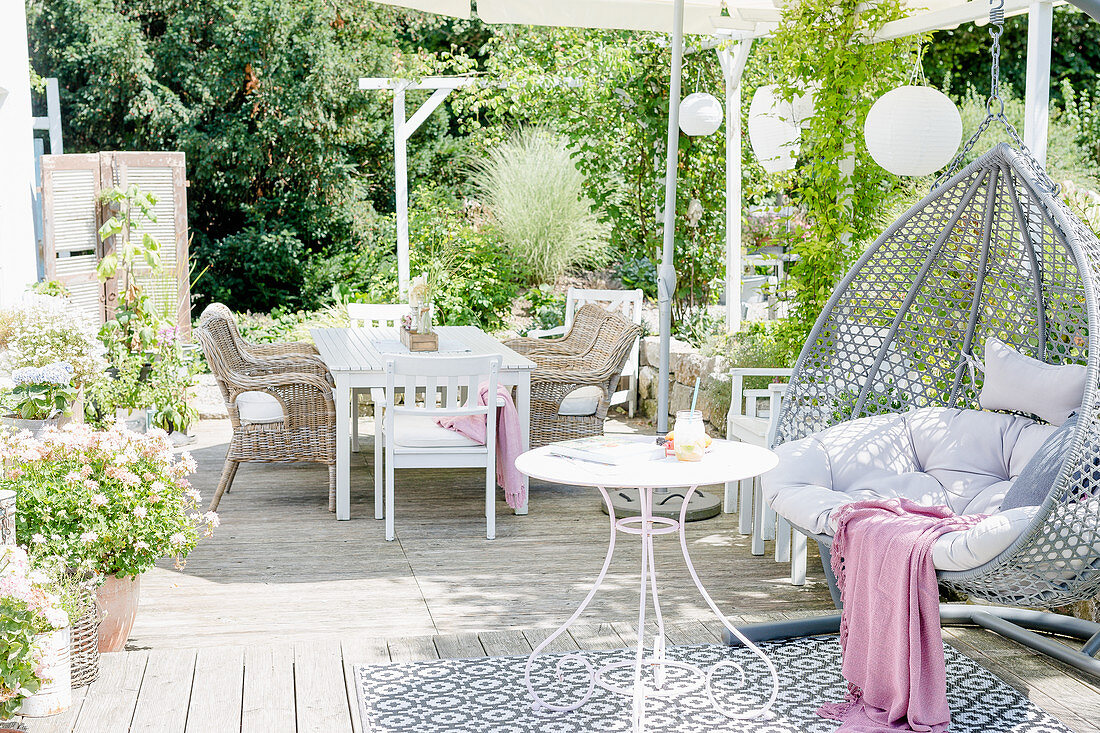 White Terrace With Hanging Chair And Sitting Area