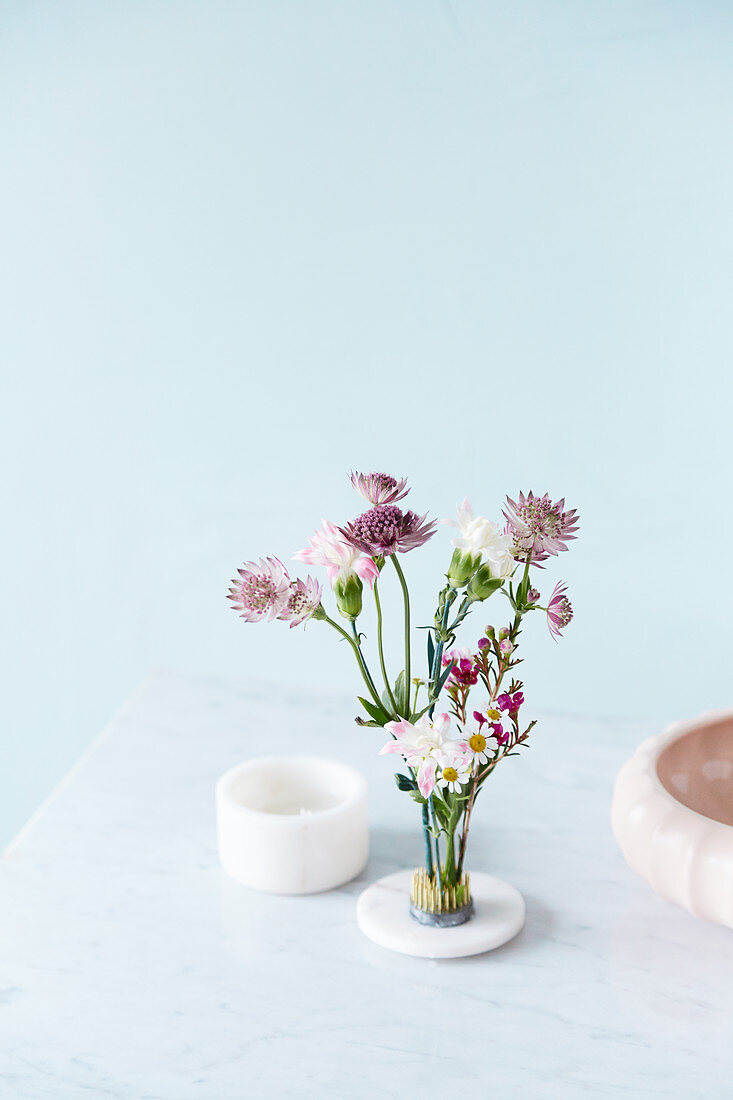 Natural flower arrangement in floral frog