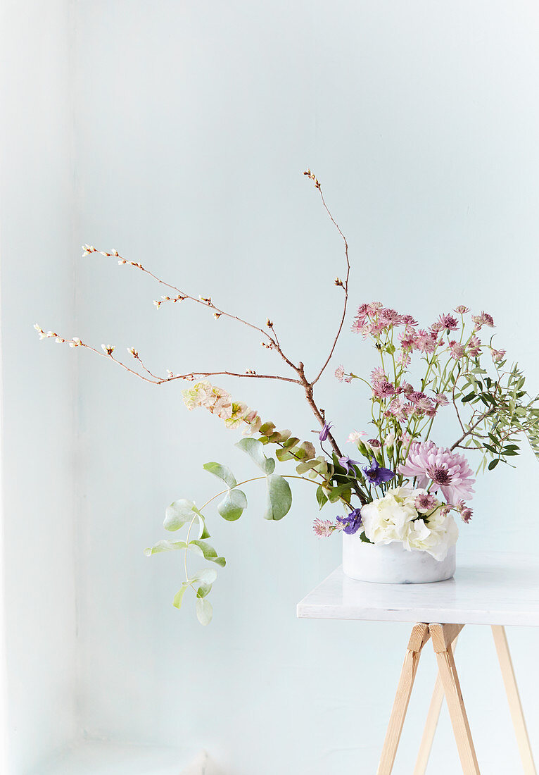 Delicate flower arrangement with astrantia and eucalyptus