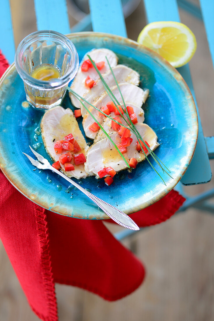 Turkey breast slices with lemon and diced pepper