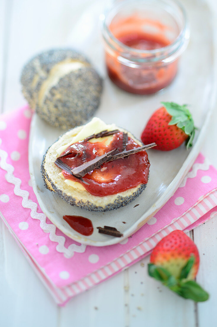 Strawberry and espresso jam with chocolate on a poppyseed roll