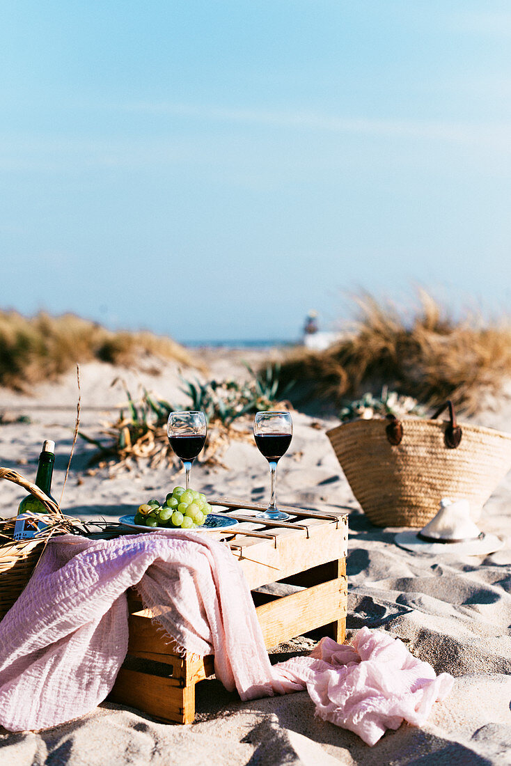 Wine and grape on beach