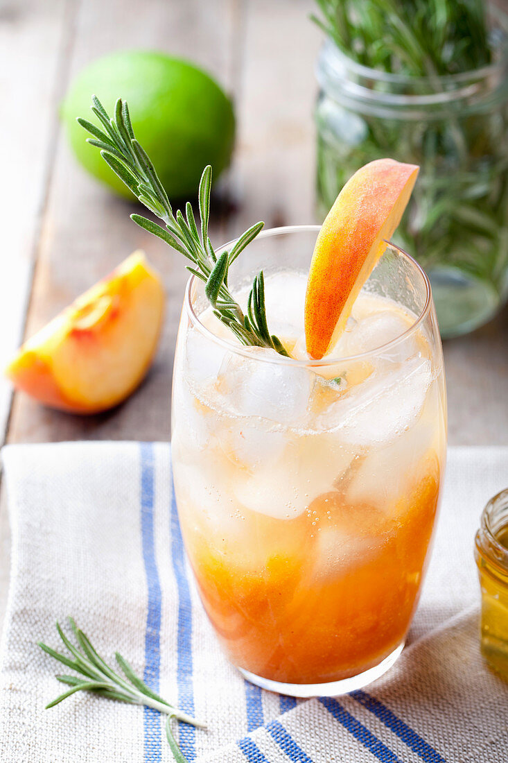 Peach and rosemary fizz cocktail