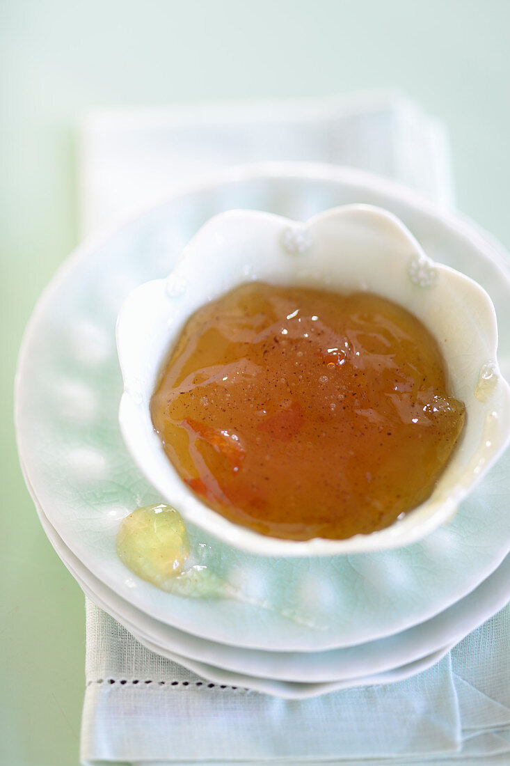 Quince and orange marmalade in a small bowl