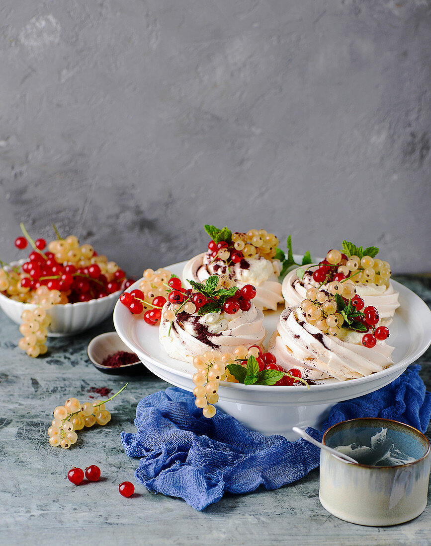 Mini pavlovas with cream and redcurrants