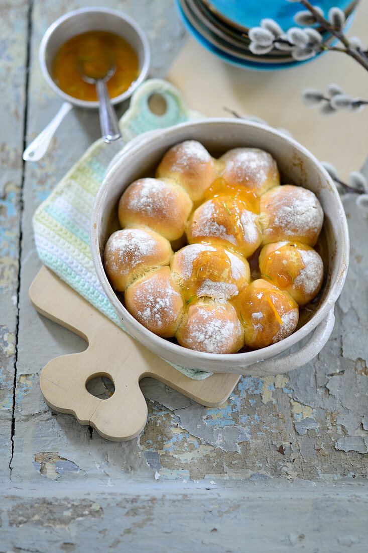 Freshly baked, sweet yeast dumplings with apricot glaze