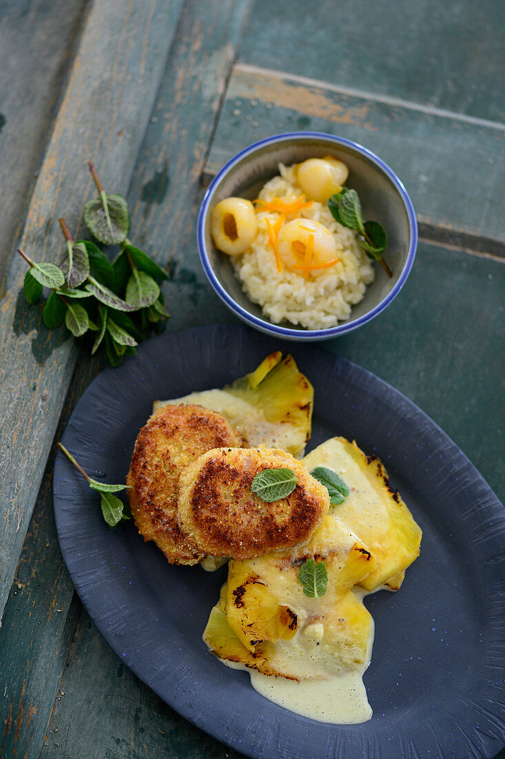 Grilled pineapple and rice fritters with lychees