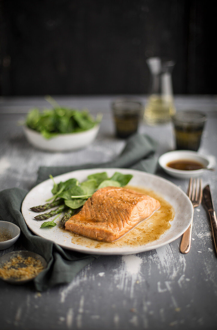 Poached salmon with spinach and asparagus