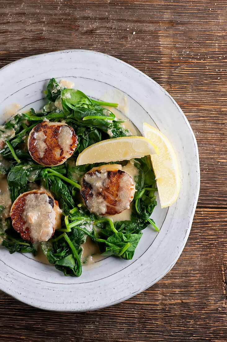 Sauteed scallops on spinach (top view)