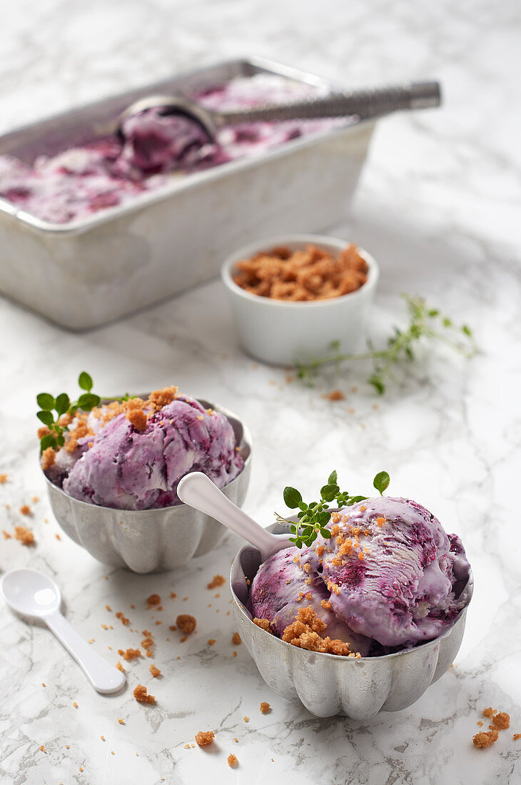 Homemade berry ice cream served with streusel
