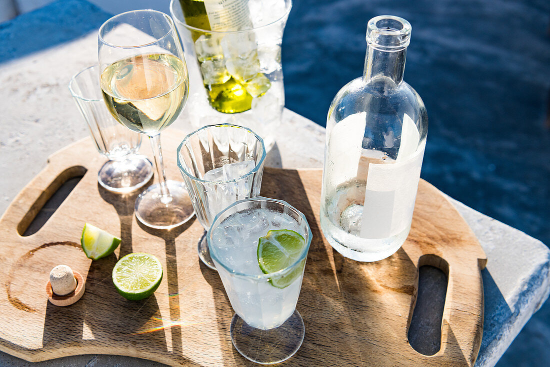 Various cocktails on a chopping board