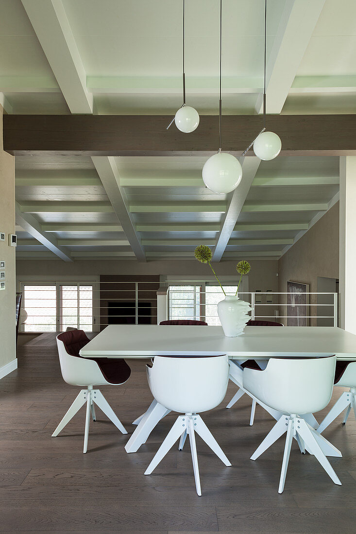 Modern dining area on gallery with beige walls