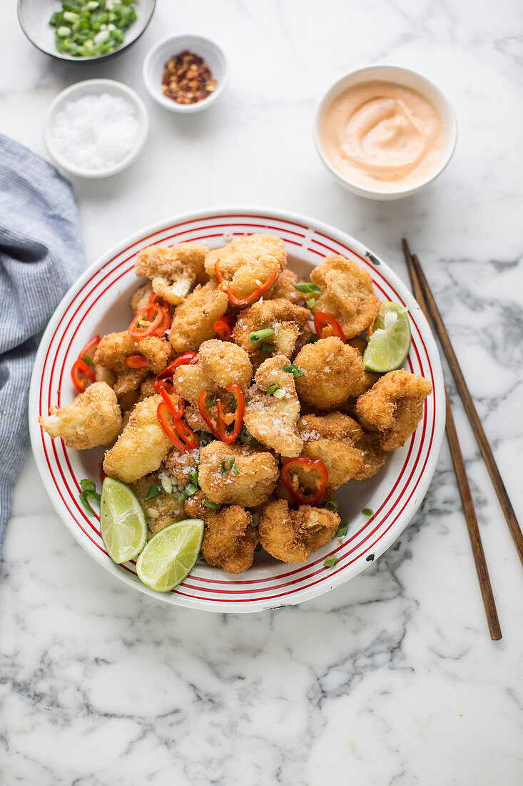 Breaded and fried cauliflower florets with a dip