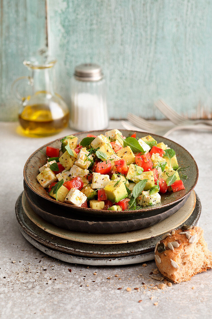 Gluten-free avocado salad with tomatoes and feta