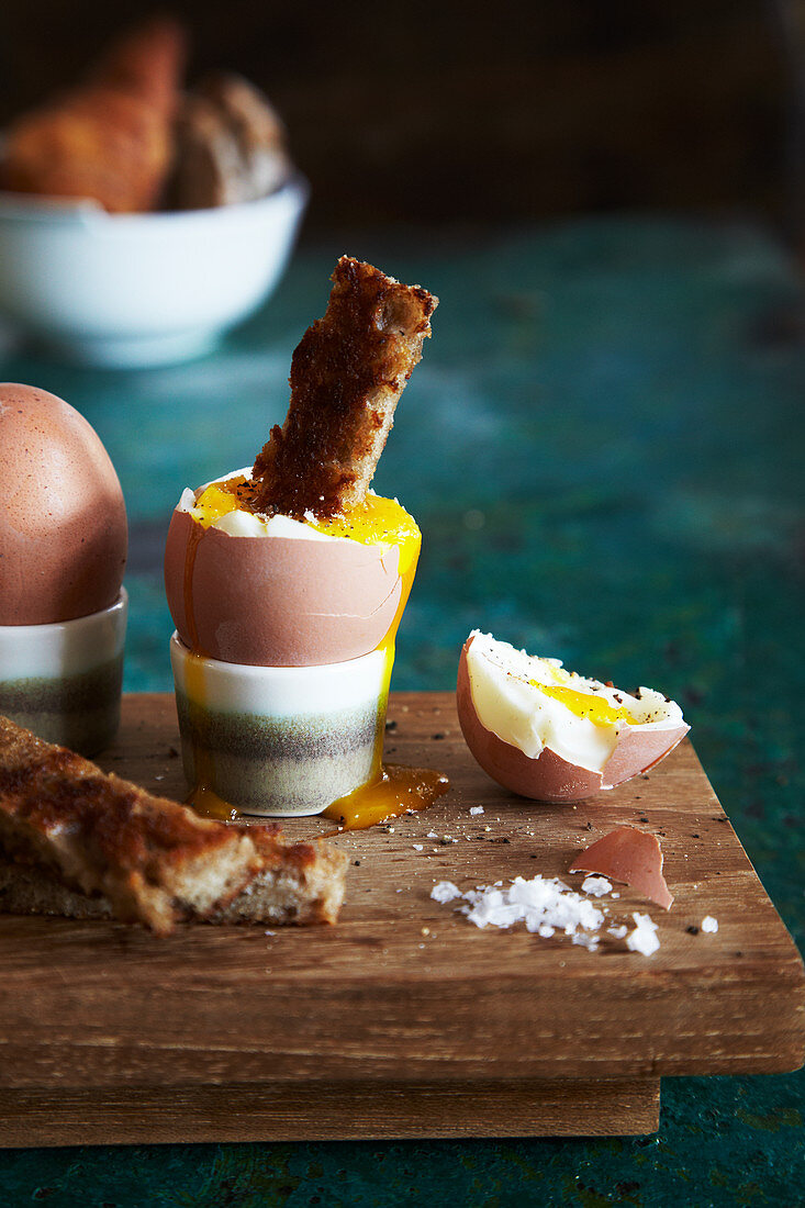 A soft-boiled egg and soldiers